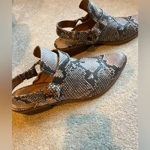 Snakeskin mule.  Strap in back. Excellent condition.